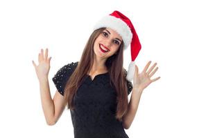 young brunette girl in santa hat photo