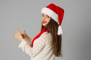 girl in santa hat and red scarf photo