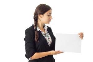 woman in uniform with white placard in hands photo