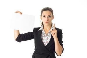 woman in uniform with white placard in hands photo