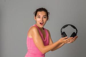 girl with headphones in studio photo