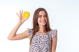 girl with orange slices in hands photo