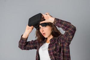 young girl testing virtual reality glasses photo