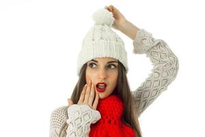 brunette girl in warm sweater and red scarf photo