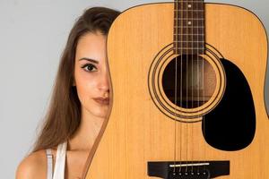 charming woman with guitar photo