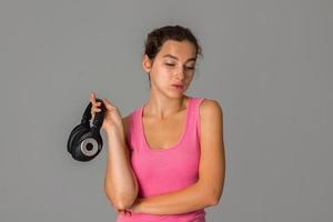 girl with headphones in studio photo