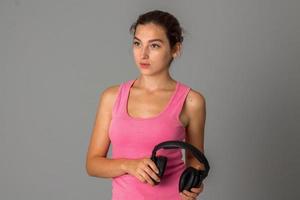 girl with headphones in studio photo