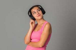 girl with headphones in studio photo