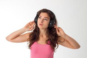 girl in headphones in studio photo