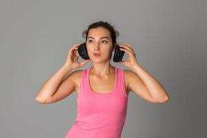 girl with headphones in studio photo