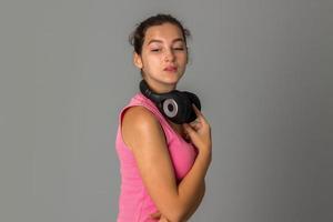 girl with headphones in studio photo