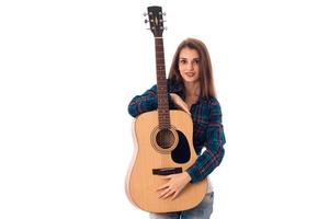 sexy brunette with guitar in hands photo