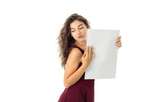 girl in red dress with white placard photo