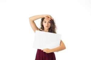 girl in red dress with white placard photo