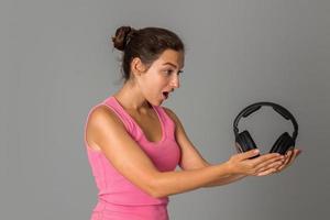 girl with headphones in studio photo