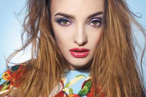 Portrait of a young sexual girl with striking makeup close-up photo