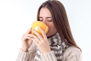 young girl got sick and drinking hot tea photo