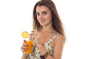 summertime portrait of young cheerful girl in light clothes with cocktail in her hands smiling isolated on white background photo