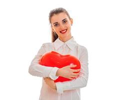 portrait of happy brunette in love with red heart isolated on white background. saint valentine's concept. love concept. photo