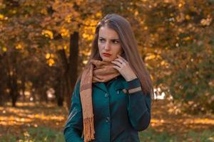 young girl looks thoughtful toward standing in the Park photo