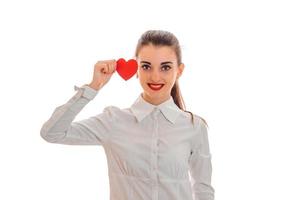 young girl smiling in a white shirt holding a postcard sweetheart photo