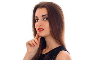 Portrait of an attractive young girl with red lipstick that looks into the camera isolated on white background photo