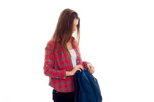 attractive young brunette students teenager in stylish clothes and backpack in her hands posing isolated on white background photo