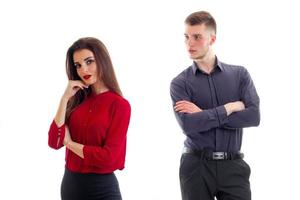 a young boy cupped his hands and looking at the beautiful girl in a red blouse photo