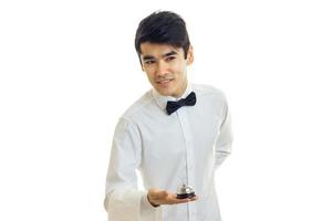 handsome young waiter leaned forward smiling photo