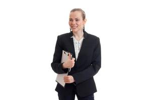 young smiling girl in black Office suit keeps the folder in the hands photo