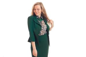 Cutie young blonde business woman in green uniform smiling with closed eyes photo