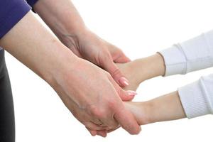 mother holding her daughter by the hand photo