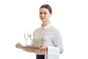 beautiful skinny waitress with glasses of wine photo