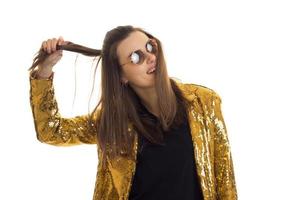 young stylish woman in golden jacket and sunglasses photo