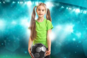 little girl plays football photo