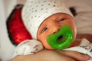 Portrait of a cute newborn girl photo