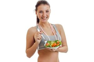 horizontal portrait smiling charming girl who holds the lettuce photo