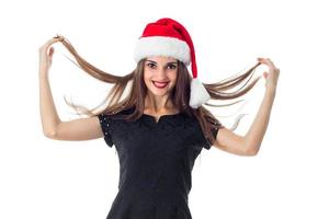 Brunette girl with Santa Claus hat photo