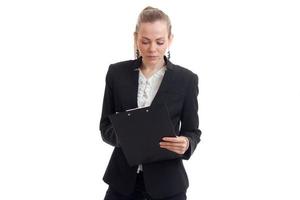 young blonde business woman make notes in tablet photo