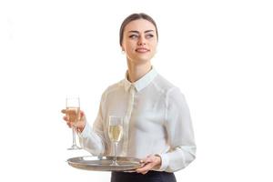 Cheerful brunette waitress in uniform smiling photo