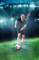 Soccer player shooting ball in the game photo