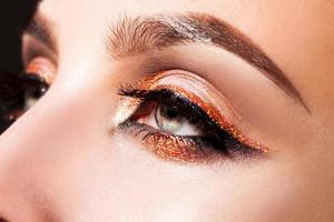 Close up photo of woman eyes with professional make up