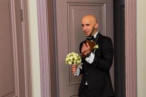 glamour young husband in a tuxedo photo