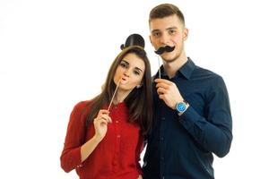 funny couple holding paper Dummies for photo and looking at camera