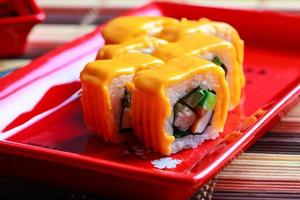 Close up photo of roll with cheese on top