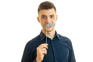 perky young guy with paper mustache photo