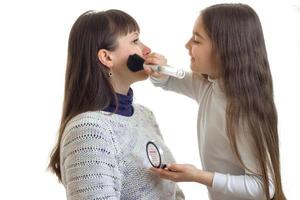 little girl with long hair strikes to the face of mom blush photo