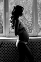 Silhouette beautiful pregnant girl photo