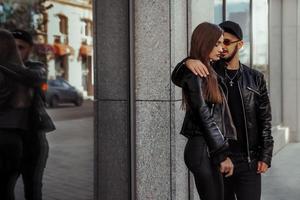 handsome couple hugs in the street photo