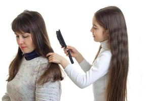 little girl makes her mom hairstyle photo